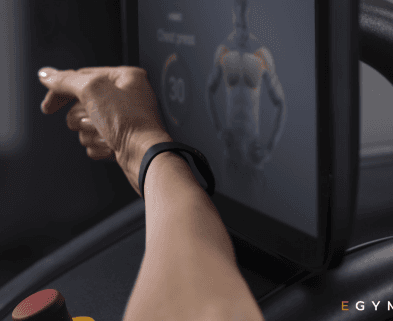 eos gym member scanning their smart band on a screen