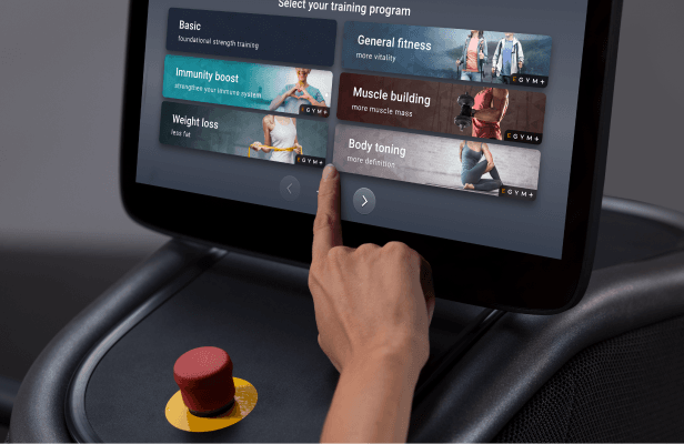 eos gym member tapping on the smart screen to pick which mode to choose