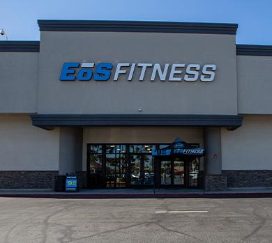 outside shot of a modern eos gym with brick walls and bright blue branding