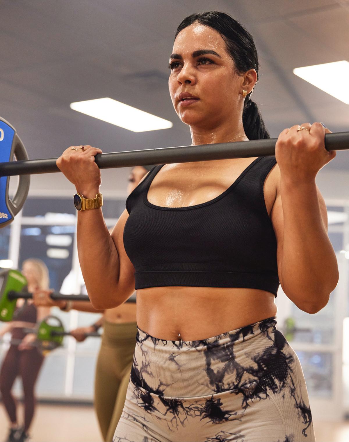 eos gym member at a body pump class