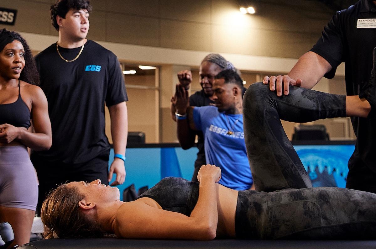 group of eos gym members at the tank doing stretches