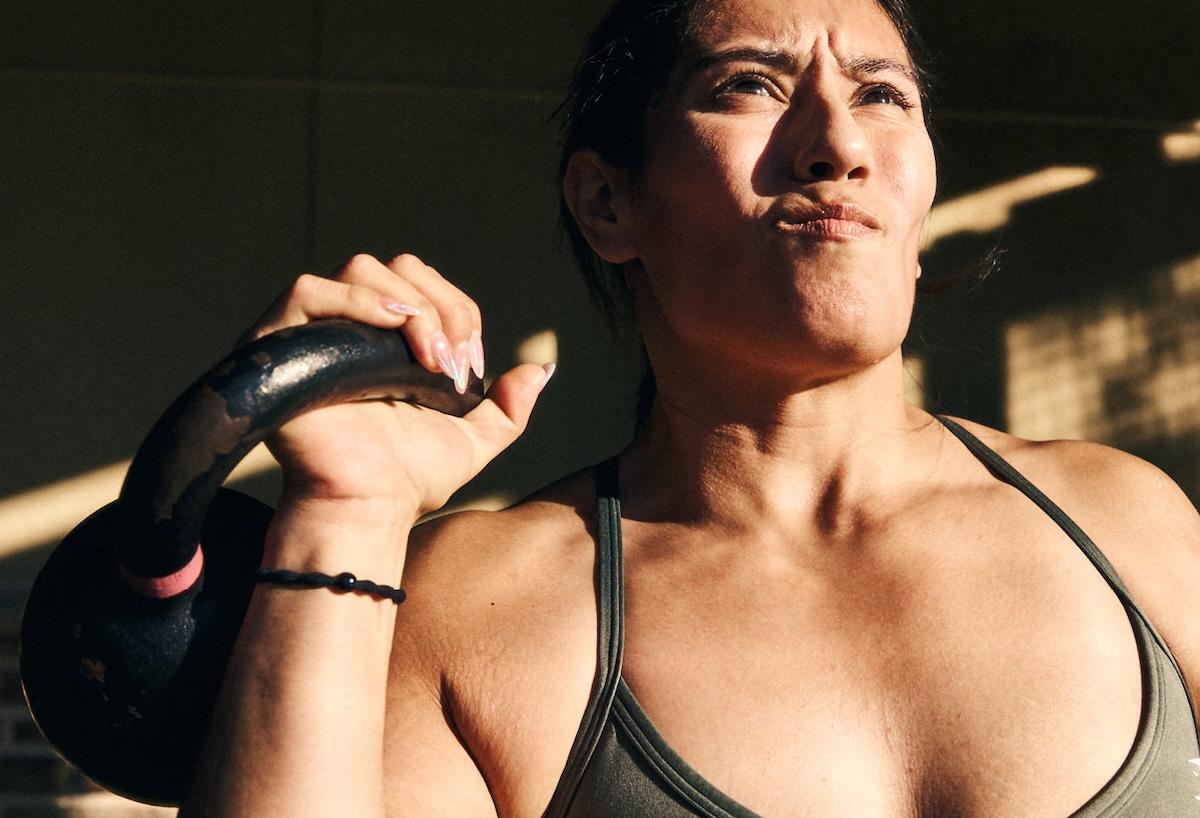 eos gym member doing drop sets in the backyard