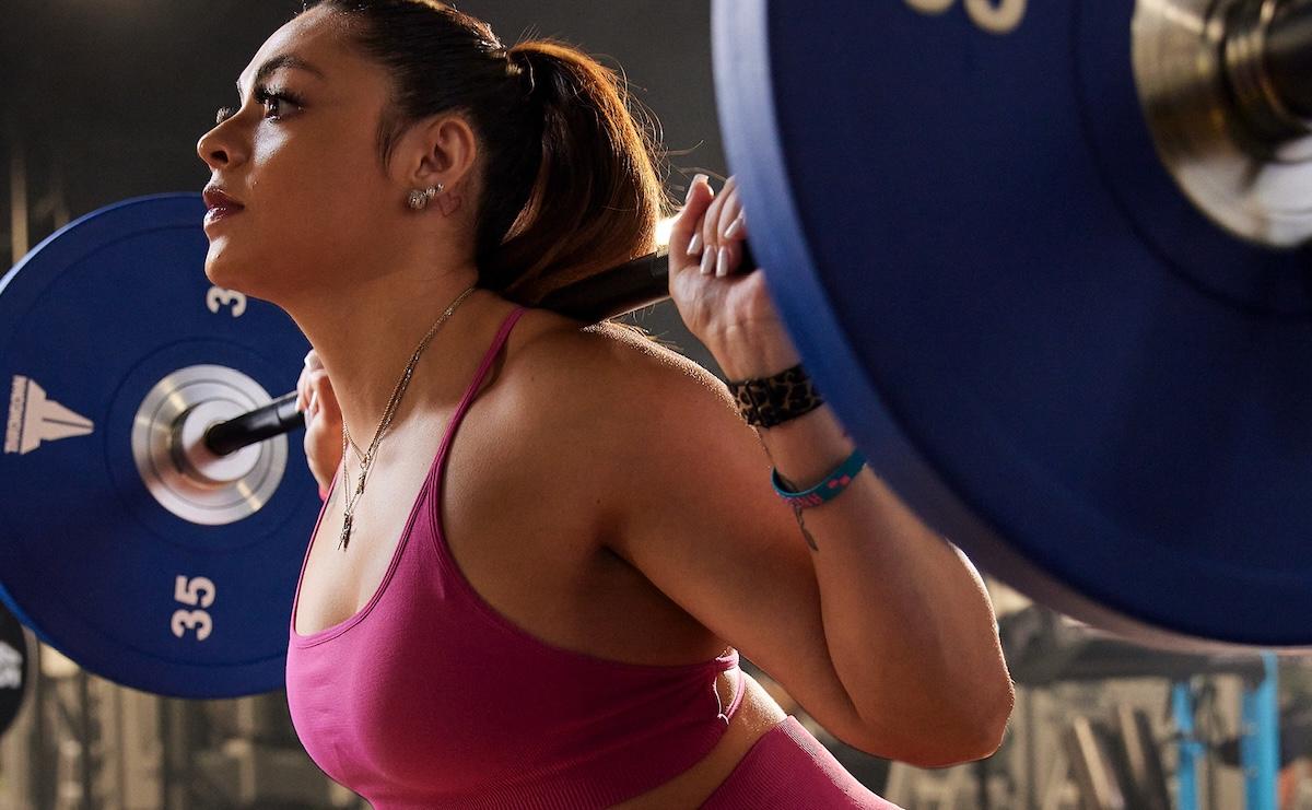 eos gym member doing squats to get stronger