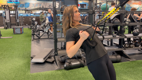 eos member performing an inverted-row