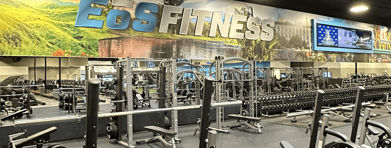 interior shot of modern eos gym with free weights and barbells