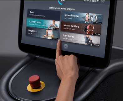 eos gym member tapping on the smart screen to pick which mode to choose