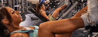 Woman using a leg press machine at the gym