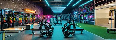 vibrant wide shot showing multiple eos gym members and fitness equipment