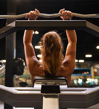 eos member lifting a barbell overhead