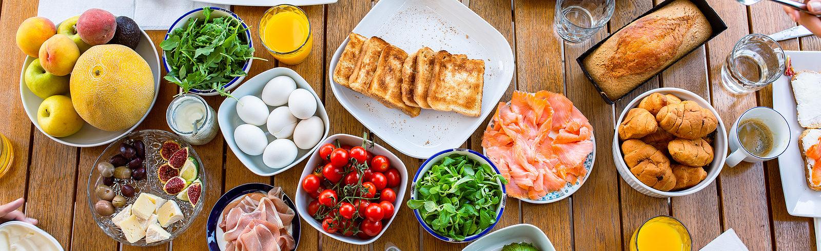a lot of different healthy foods displayed on a table