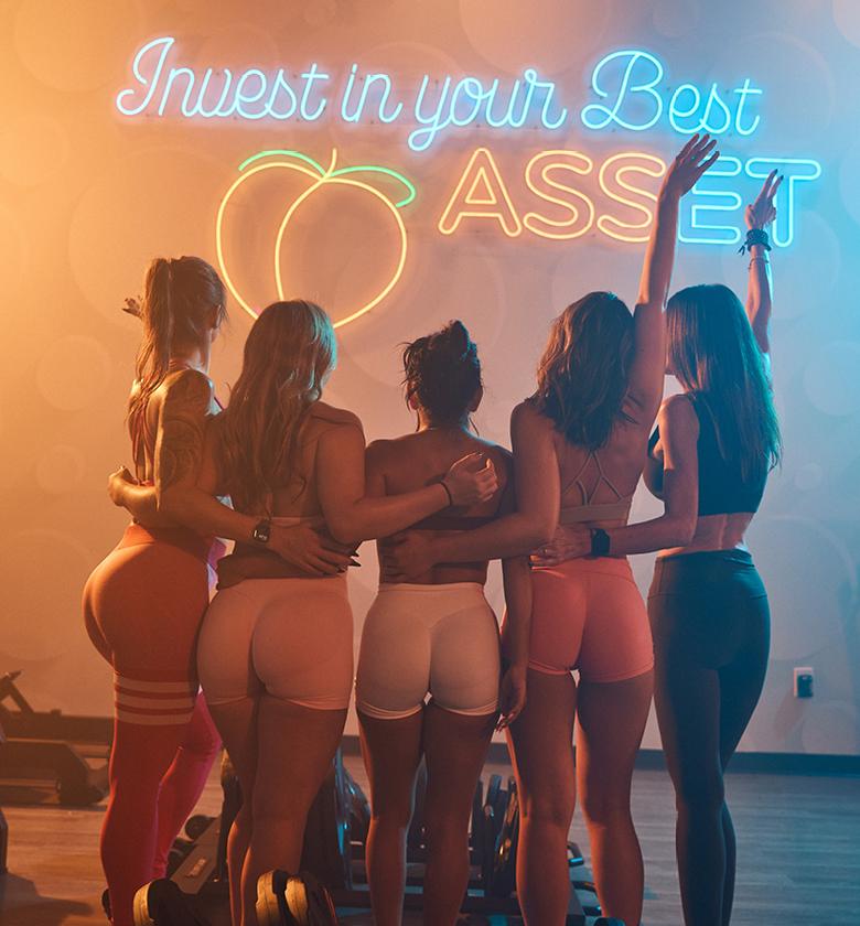 eos gym members celebrating after working out their glutes at booty builder lab