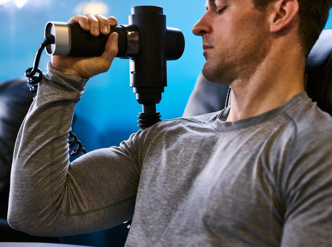 eos gym member using hyperice