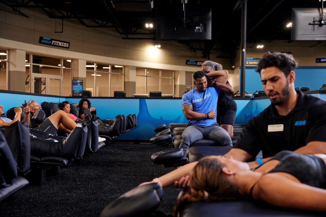 group of eos members getting stretch out in recovery room and using cryo chairs