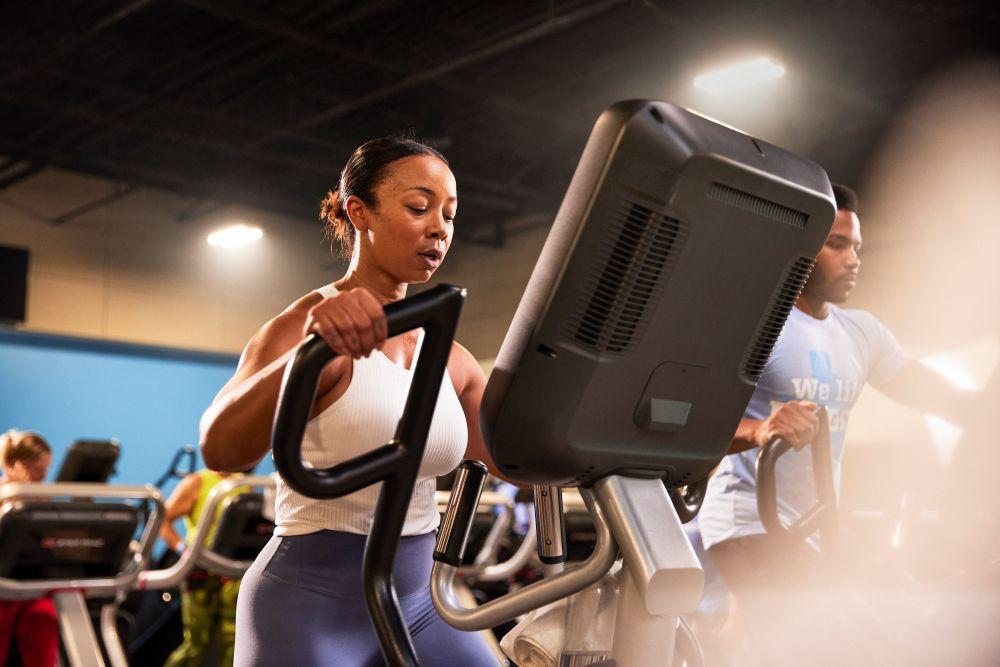eos gym member on elliptical machine
