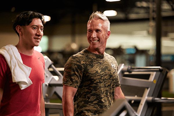 two happy eos gym members walking