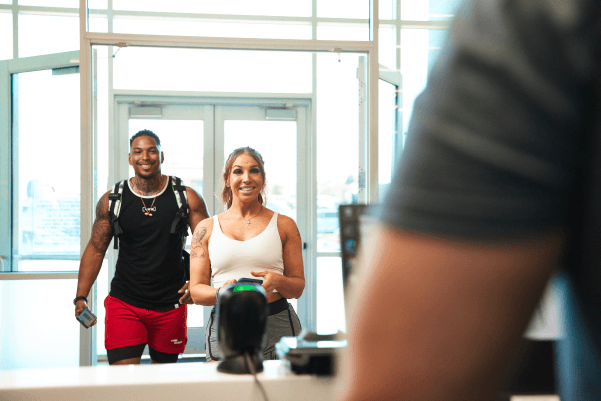 two eos gym members checking in