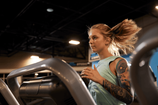 eos gym member running on tredmill