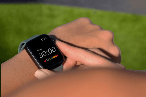 eos gym member tracking their stats on smart watch