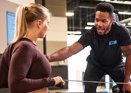 personal trainer coaching newer eos gym member