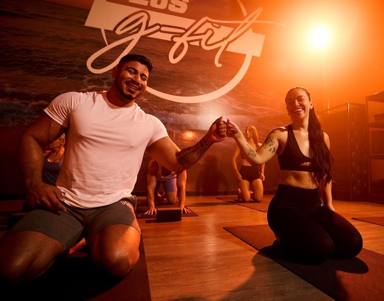 two eos gym members working out together