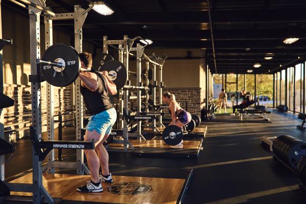 eos gym members doing weight training at an eos backyard