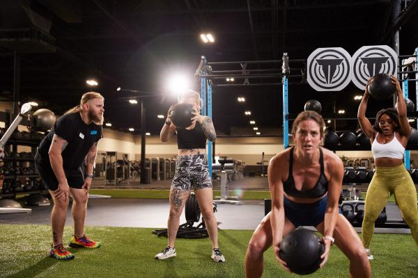 group class doing hiit on indoor turf