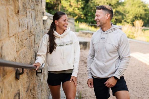 two eos gym members enjoying some brand new merch from eos