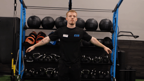 eos gym member doing arm swings