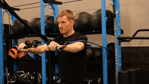 eos gym member doing banded chest rows