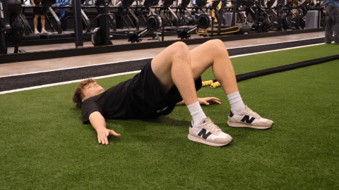 eos gym member doing glute bridges