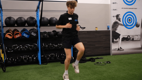 eos gym member doing high knees