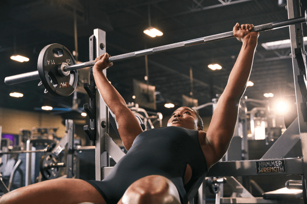 eos gym member doing incline bench press