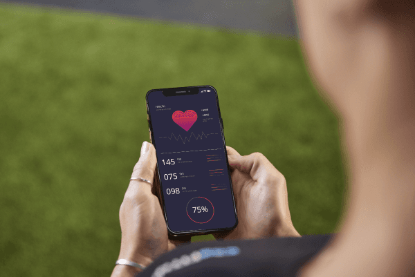 eos gym member looking down at phone