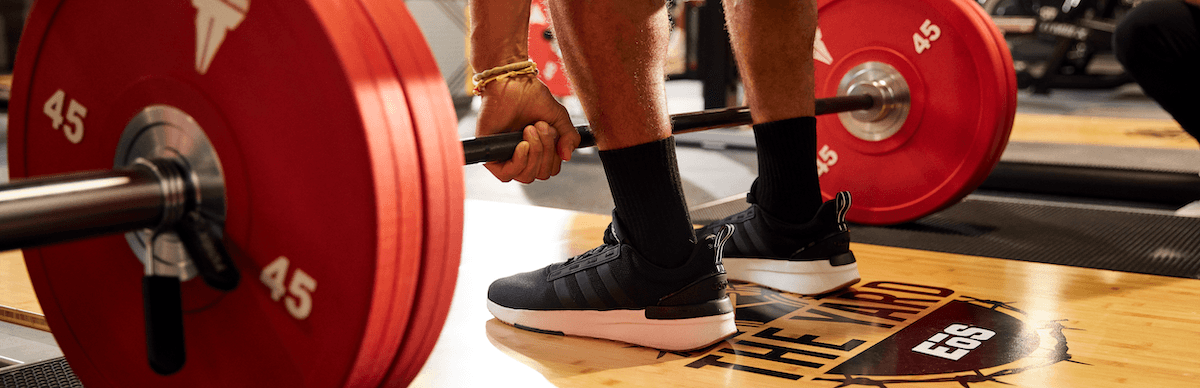 close up shot of eos gym member deadlifting on platform