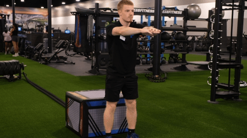 eos gym member doing seated squats