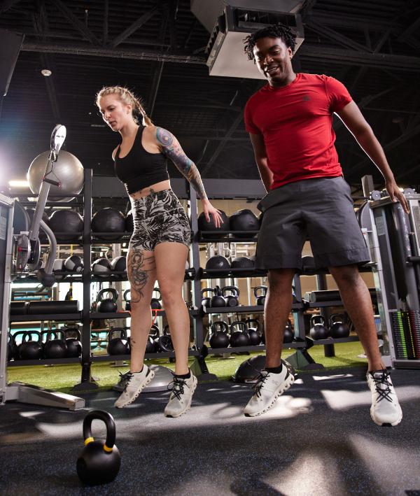 two eos gym members doing dynamic workouts together