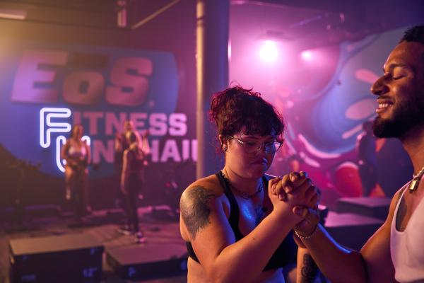 two eos gym member celebrating after a group fitness class