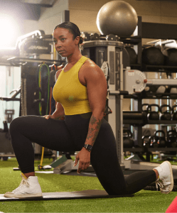 eos fitness gym member performing a dynamic stretch