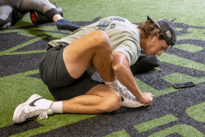 eos fitness gym member performing a dynamic stretch