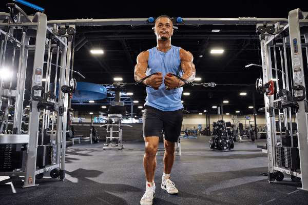 eos fitness gym member working out on cable chest fly machines