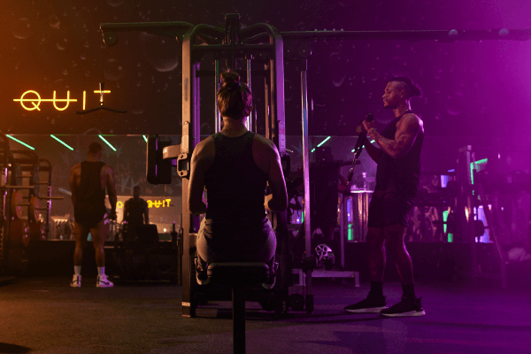 eos fitness gym members doing rows and pull downs at the set