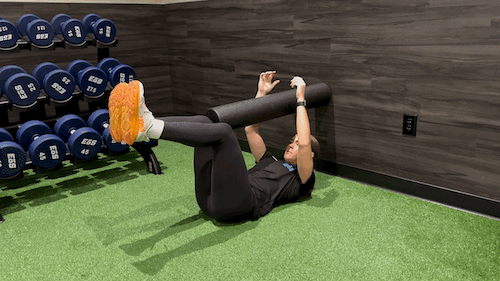 dead bug with foam roller stretch