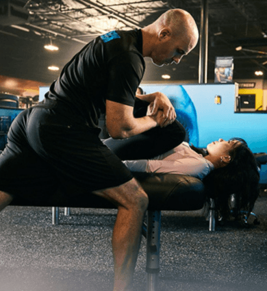group of eos gym members at the tank doing stretches