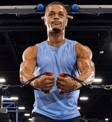 eos fitness member doing arm exercises on cable machine