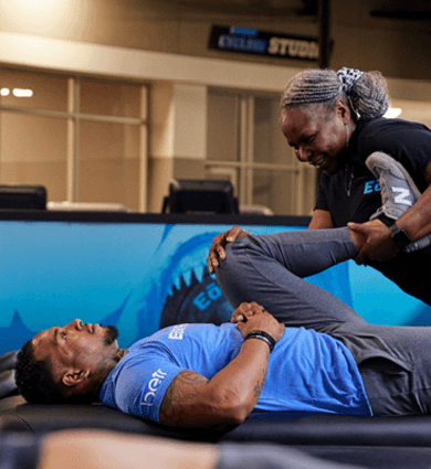 eos myofascial technician doing assisted stretch with eos memeber