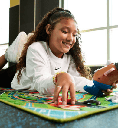Child playing in the EōS Kids’ Club