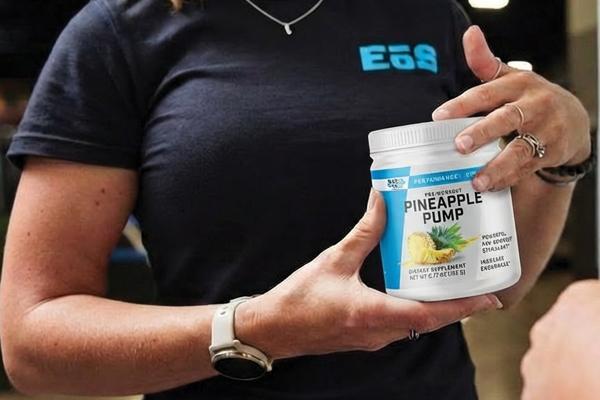 eos employee holding ng2 pre-workout