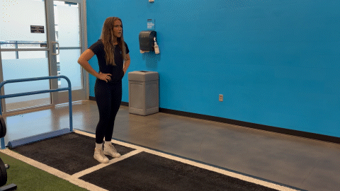 eos fitness member performing an isometric lunge hold