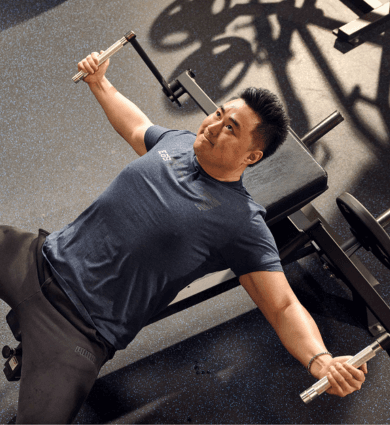 eos fitness member performing chest exercises