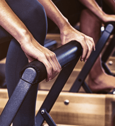 eos fitness members using pilates reformers